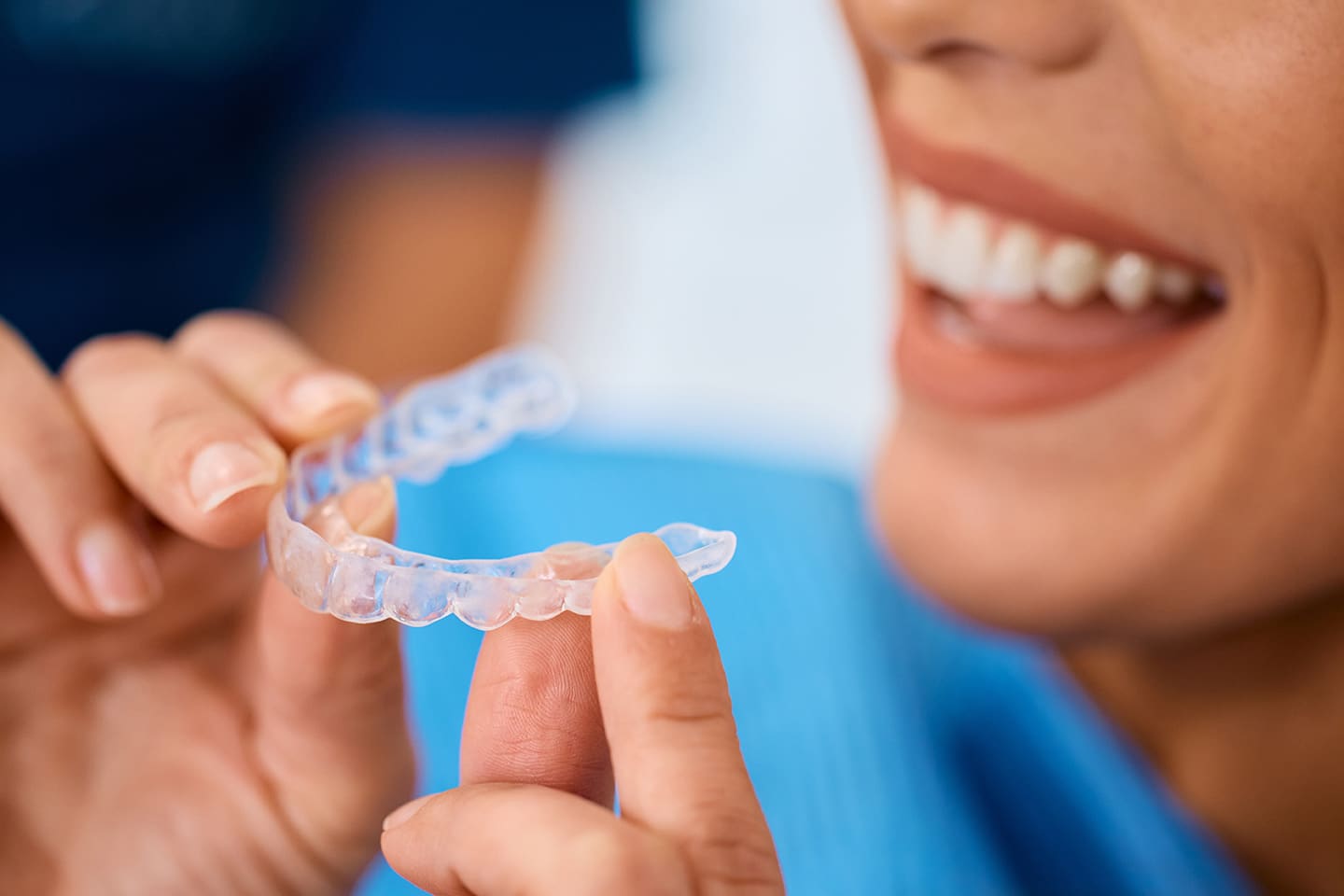 woman holding a dental night guard from longpoint dental