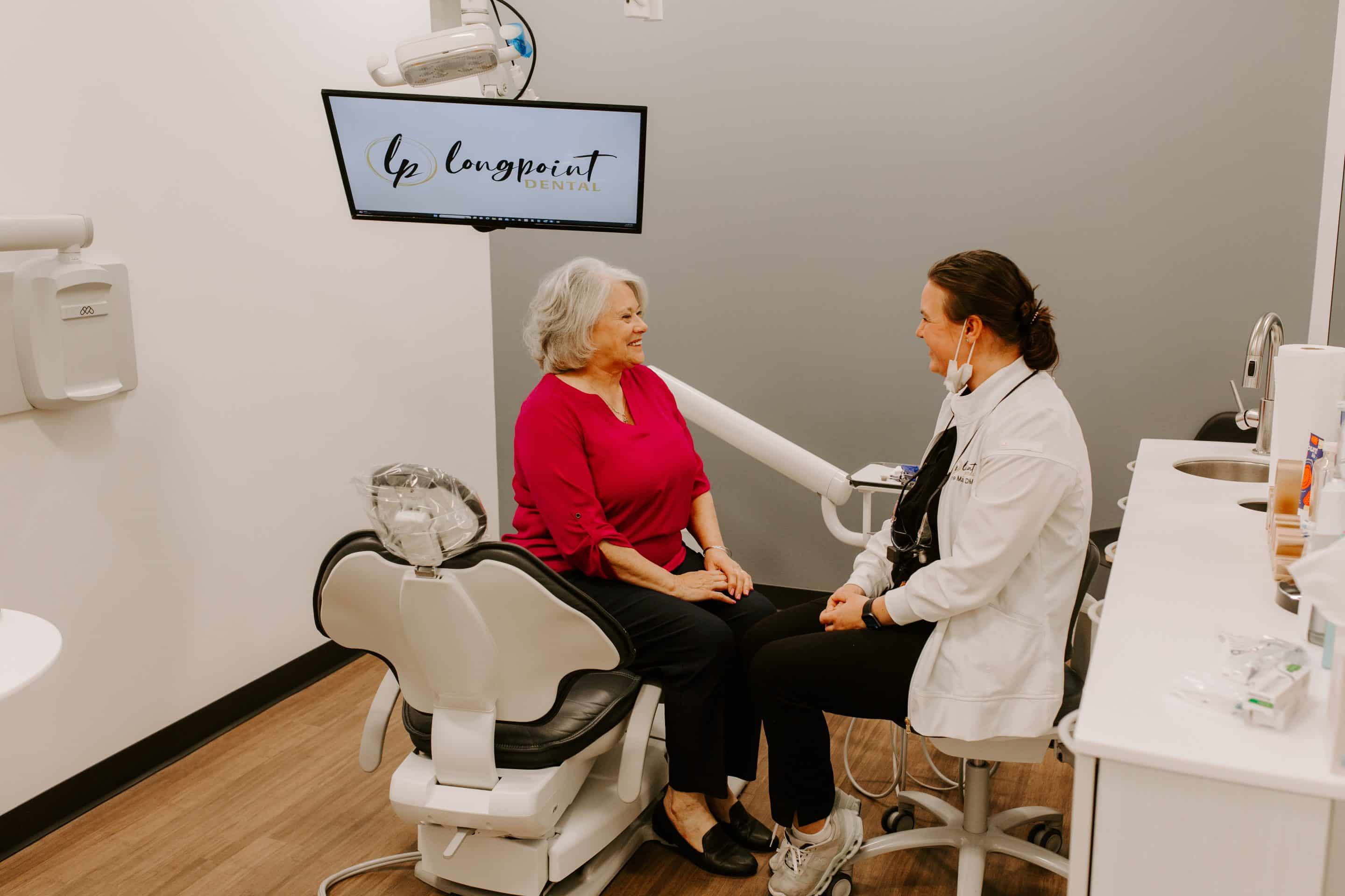 Lady smiling at a dental appointment with Longpoint dental