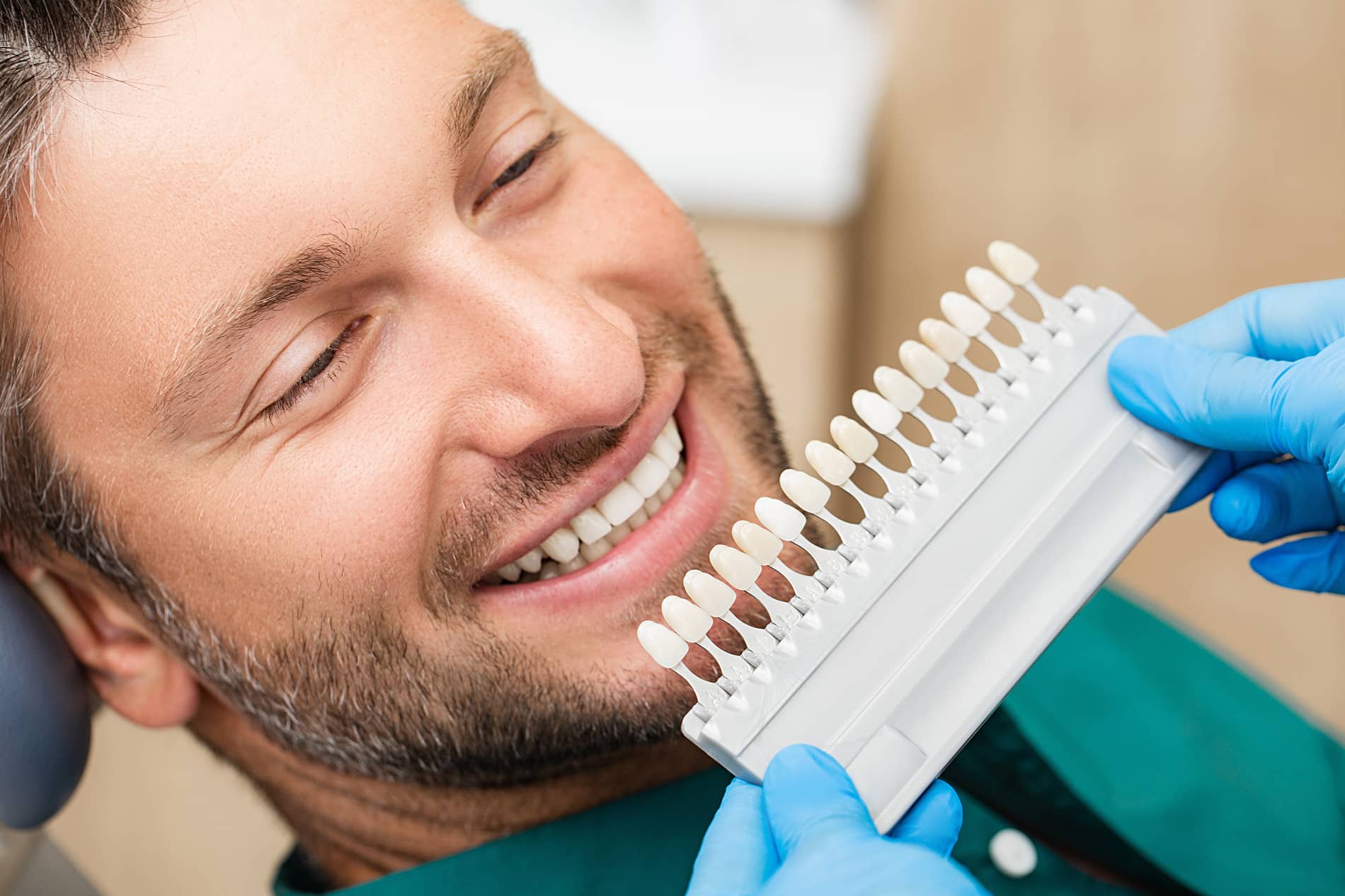 Man learning about long term care at his veneers appointment in Franklin TN
