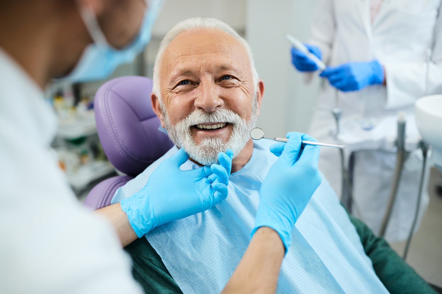 Man at a dental implant consultation learning if he is a good candidate for implant restorations in Franklin TN