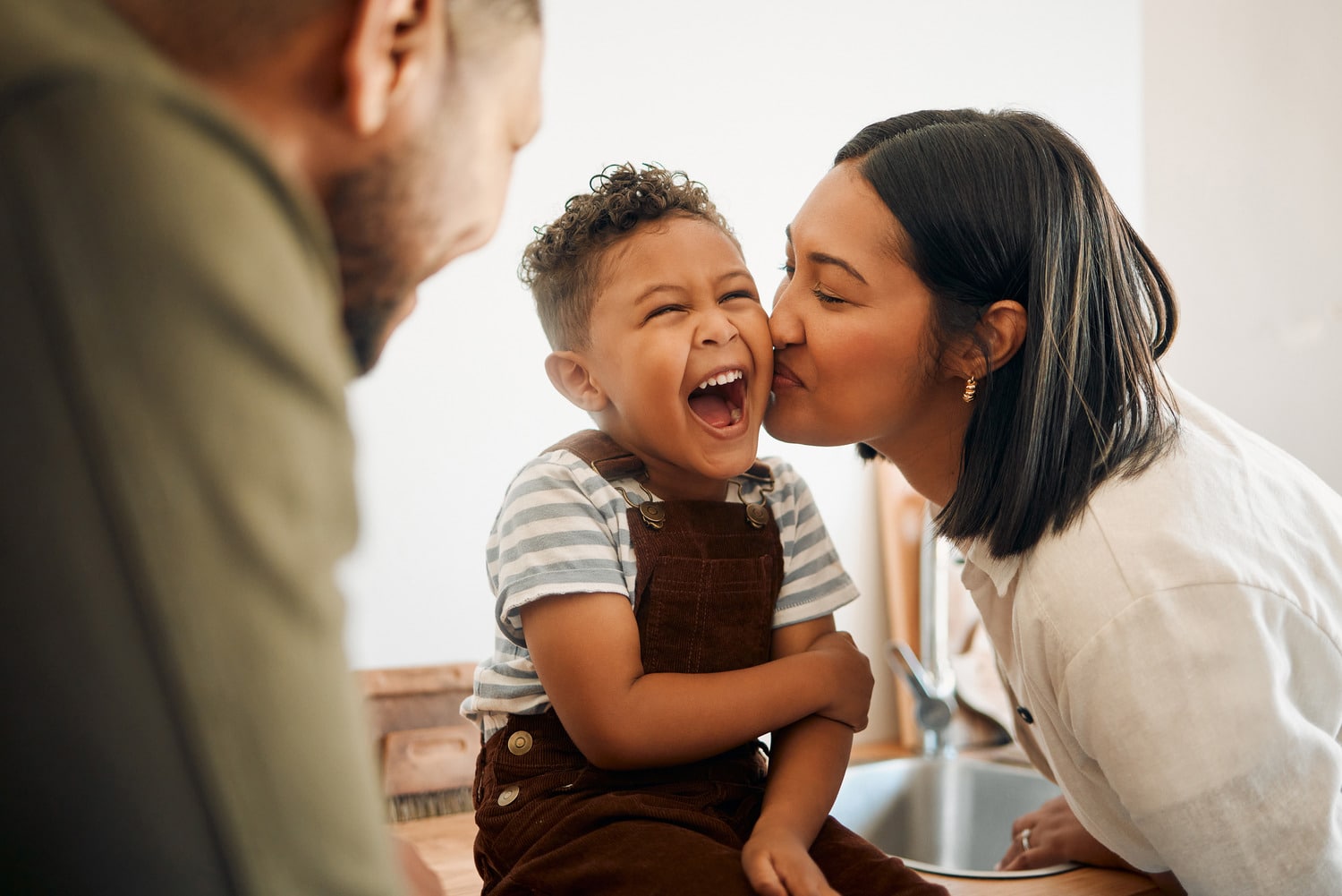 Family laugh together at the dentist for family dental care in Franklin TN