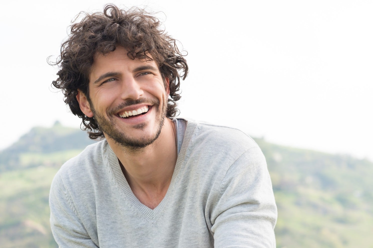 Man smiles after a successful dental extraction in Franklin TN